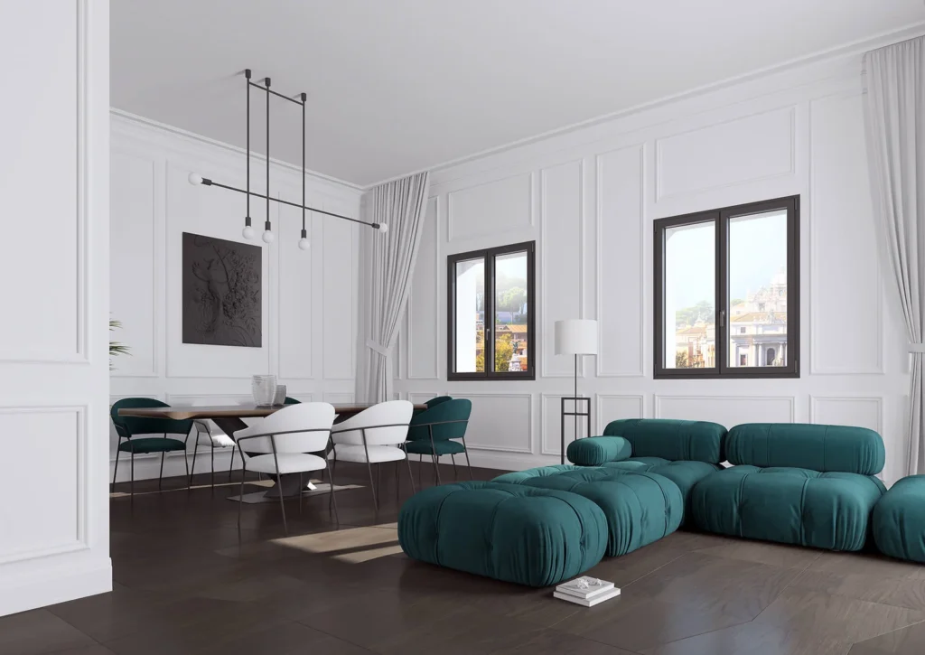 Elegante sala da pranzo con finestre a battente nere che incorniciano il panorama urbano, evidenziando l'importanza di una consulenza finestre per valorizzare l'estetica degli interni.